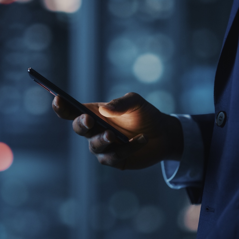 Man using MCP SHIELD Anti-fraud for mobile payments, VAS and DCB